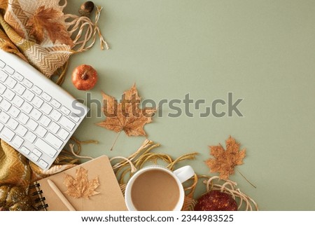 Creating a cozy home office for autumn. Top view shot of pen, copybook, keyboard, warm plaid, acorns, pumpkins, dry leaves on pastel olive background with blank space for advert or text Royalty-Free Stock Photo #2344983525