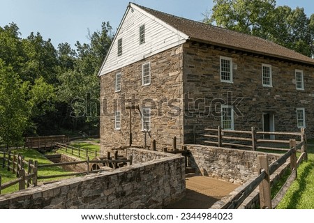 Historic Peirce Mill with mill race, built in 1829. The mill ground corn, wheat, and rye until 1897. Rock Creek Park, Washington, DC Royalty-Free Stock Photo #2344984023