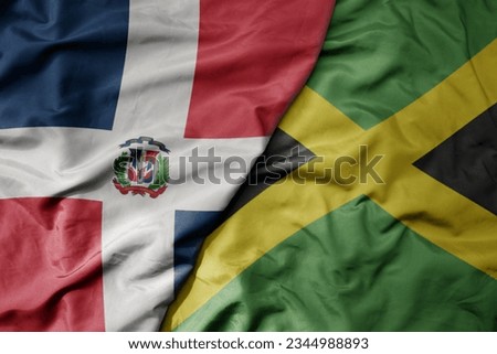 big waving realistic national colorful flag of cuba and national flag of jamaica . macro
