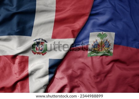 big waving realistic national colorful flag of cuba and national flag of haiti . macro Royalty-Free Stock Photo #2344988899