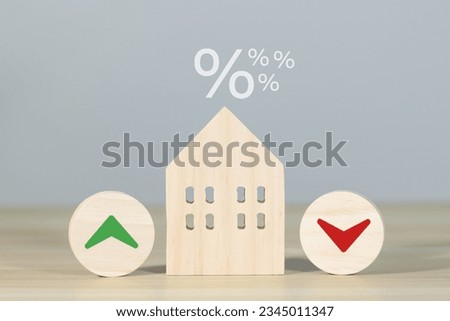 Financial interest rate on wooden block with percentage sign and up arrow, financial growth, interest rate increase, inflation rate, selling price and tax hike concept and rate simulation