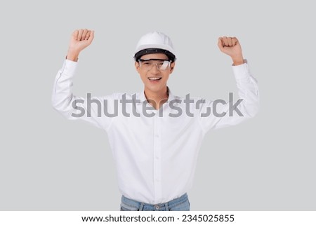 Portrait young asian engineer man wearing helmet excited isolated white background, male is architect or contractor with glad and success, contractor proud and satisfied, industrial concept.