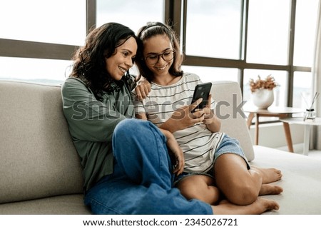 Single parenthood. Mother and daughter spending time together at home. Royalty-Free Stock Photo #2345026721