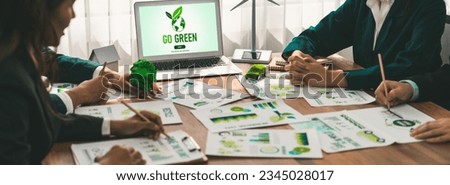 Go green ecology awareness campaign display on laptop on eco-friendly company meeting with business people implementing environmental protection for clean and sustainable future ecology. Trailblazing Royalty-Free Stock Photo #2345028017