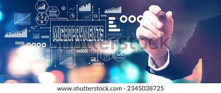 Micropayments theme with a businessman in a blurred city lights at night Royalty-Free Stock Photo #2345038725