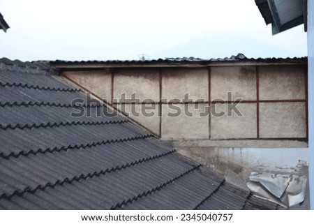 Aerial view of roofing work being done on a house Royalty-Free Stock Photo #2345040757