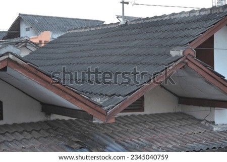 Aerial view of roofing work being done on a house Royalty-Free Stock Photo #2345040759