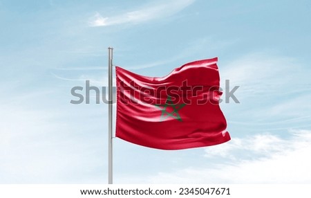 Morocco national flag waving in beautiful sky. Royalty-Free Stock Photo #2345047671