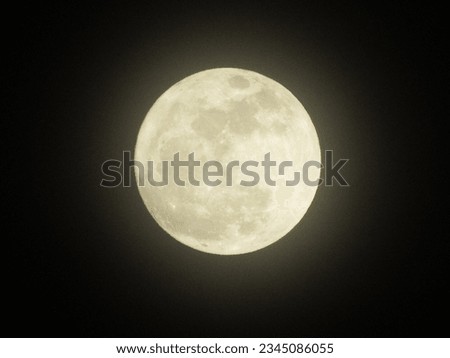 a bright full moon picture with a visible luminousity around it