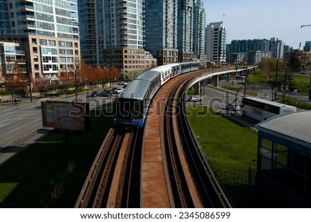 train passing through the city Royalty-Free Stock Photo #2345086599