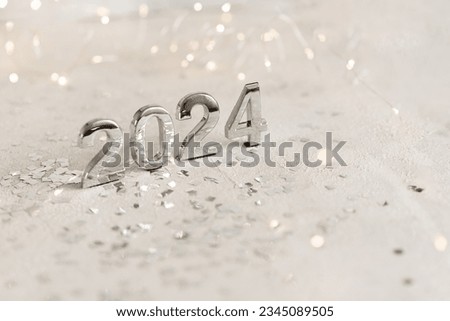 happy new year 2024 background new year holidays card with bright lights,gifts and bottle of hampagne Royalty-Free Stock Photo #2345089505