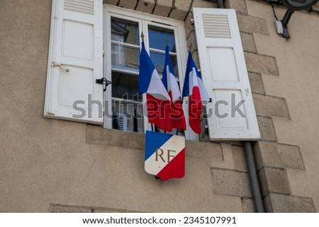 city hall facade with RF french flag on town hall entrance in gueret France Royalty-Free Stock Photo #2345107991