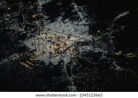 The city lights of Baghdad, Iraq, split by the Tigris River, are pictured from the International Space Station as it orbited 261 miles above the Middle Eastern nation.
