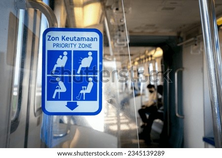 Priority seating zone for elderly and pregnant people in a public transport.