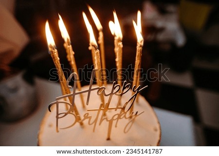 Happy Birthday cake with lit candles