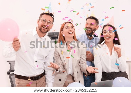Coworkers having fun during office party indoors Royalty-Free Stock Photo #2345152215
