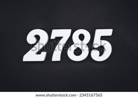 Black for the background. The number 2785 is made of white painted wood.