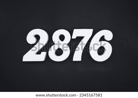 Black for the background. The number 2876 is made of white painted wood.