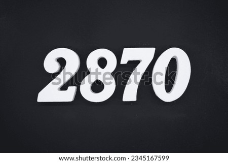 Black for the background. The number 2870 is made of white painted wood.