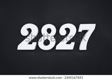 Black for the background. The number 2827 is made of white painted wood.