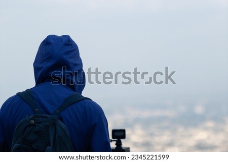 Back scene of woman alone with feeling lonely and depressed on blurred background of beautiful nature scenery . concept of woman who had to be alone in past was depressed when she encountered problems Royalty-Free Stock Photo #2345221599