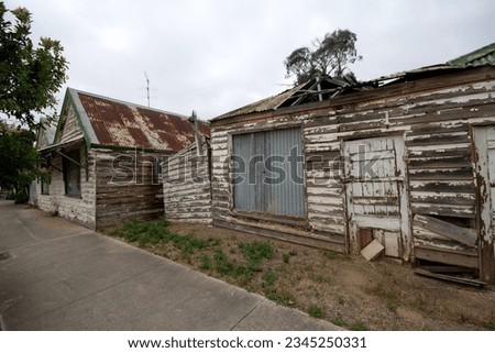 A falling apart, dilapidated abaondoned house in rural Australia Royalty-Free Stock Photo #2345250331