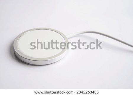 Wireless charger, magnetic charging modern equipment of mobile phone. Royalty-Free Stock Photo #2345263485