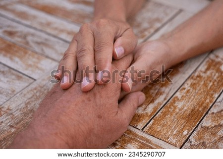 Old mature people holding hands close up view, senior retired family couple express care and psychological support concept, trust in happy marriage, empathy hope
