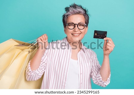 Photo of office manager lady enjoy futuristic shopping carry much bargains promo ad debit plastic card isolated on blue color background