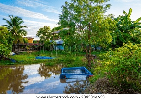 View of garden in countryside on sunset sky background