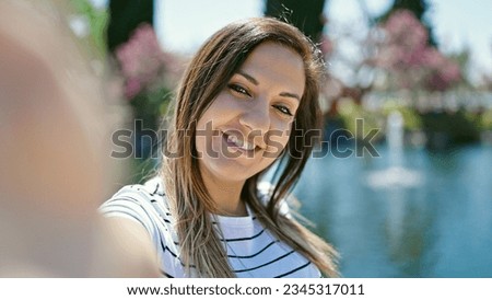 Middle eastern woman smiling confident making selfie with camera at seaside