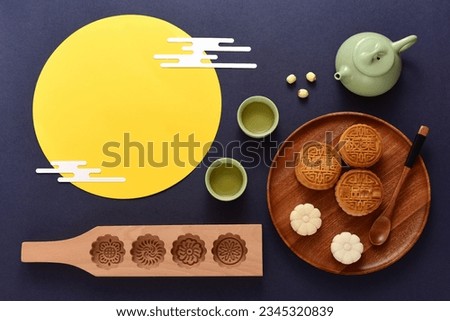 Background of Chinese Traditional Festival Mid-Autumn Festival.The Chinese meaning on the mooncake in the picture is: high-quality five kernels, milk flavored grapes, chestnuts, three flavors.