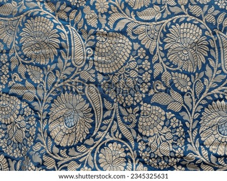  Intricate floral jaal woven in gold and blue silk brocade