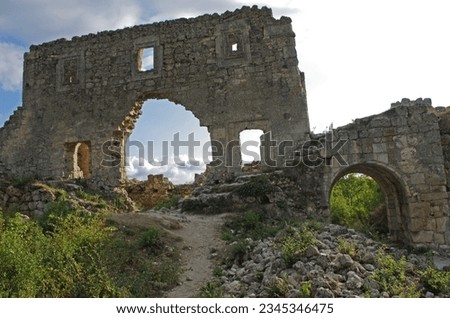 Stone ancient ruins Principality of Theodoro-Mangup in Gothia south-west of Crimea, Crimean Goths Empire of Trebizond. Mountain landscape with landmarks. Broken stone wall textures