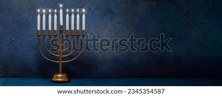 Jewish Hanukkah Menorah 9 Branch Candlestick. Holiday Candle Holder. Nine-arm candlestick. Traditional Hebrew Festival of Lights candelabra. Background for design with copy space. Royalty-Free Stock Photo #2345354587