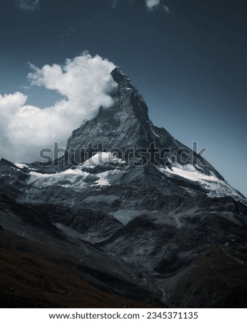 A vertical shot of the Matterhorn, a mountain of the Alps on the border between Switzerland and Italy.
