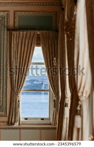Windows with curtains, with a view to the sea stock photo