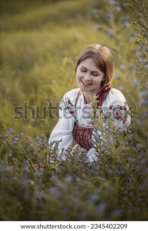 Photo of a village girl in a folk costume.