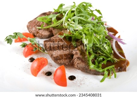 A pieces of steaks with salad and sauce. Fresh juicy delicious Beef steak. Grilled meat