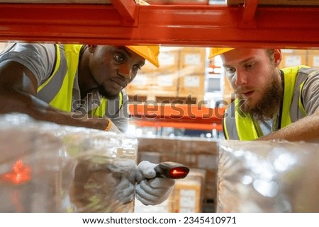 Storehouse workers are checking stock and inventory in retail warehouse. Business factory industry concept. Royalty-Free Stock Photo #2345410971