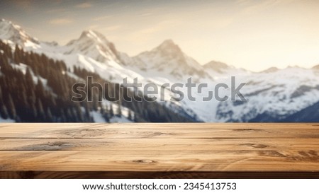 The empty wooden table top with blur background of Alpine with snow capped. Exuberant image. Royalty-Free Stock Photo #2345413753