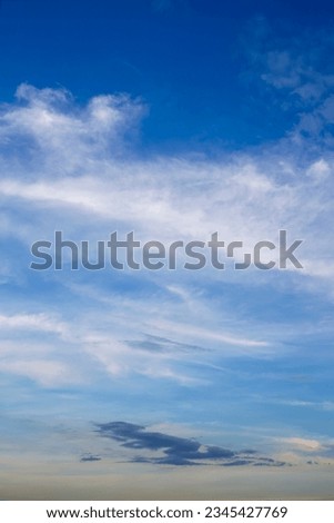Skyscape with White, fluffy clouds in blue sky. Background for website and design asset