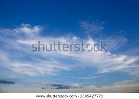 Skyscape with White, fluffy clouds in blue sky. Background for website and design asset