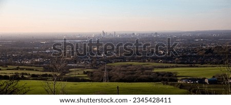The panoramic view of greenery before the Manchester cityscape in the morning