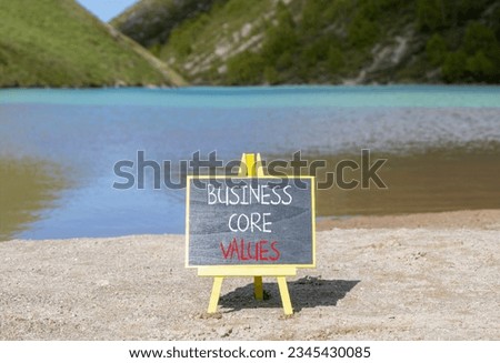 Business core values symbol. Concept words Business core values on beautiful black chalk blackboard. Beautiful mountain lake background. Business motivational business core values concept. Copy space.