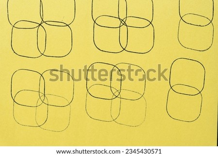 yellow construction paper featuring overlapping squares with rounded corners ink stamp pattern