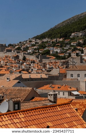 Panorama of Dubrovnik. Ancient city and path along the walls show a wonderful medieval city preserved in every detail. Orange roofs. City and walls overlooking the sea. Famous for Game of Thrones.