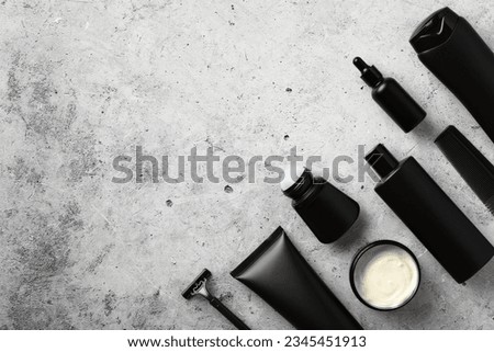 Set of professional cosmetics for men on stone table in bathroom. Flat lay, top view, overhead. Royalty-Free Stock Photo #2345451913