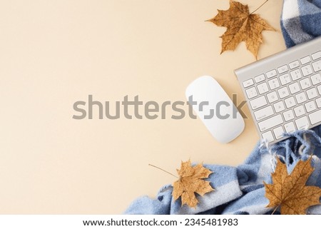 Embrace the fall atmosphere in your office. Top view photo of keyboard, computer mouse, patchy blanket, autumn maple leaves on pastel beige background with empty space for promo or text