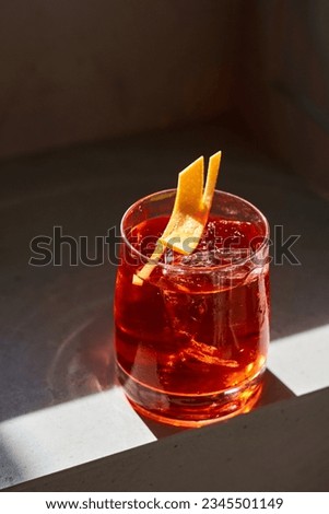 Negroni cocktail on a stone background                                Royalty-Free Stock Photo #2345501149